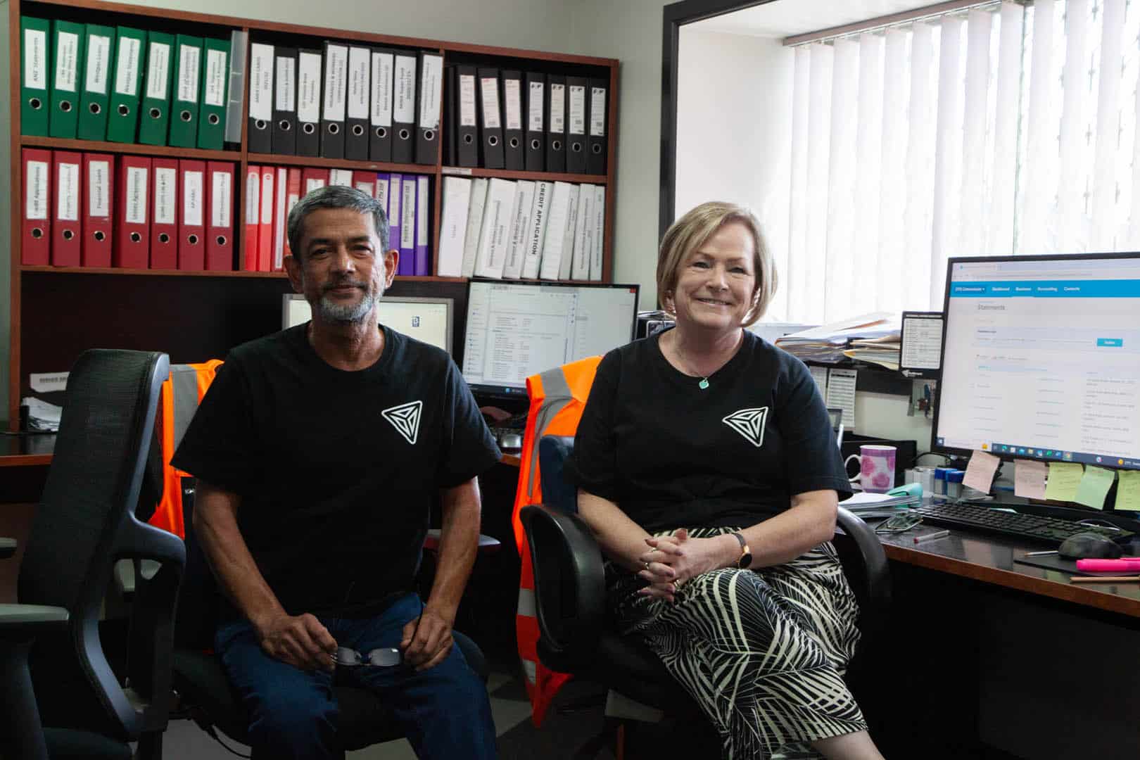 Two Fulfilment Australia employees working at the head office